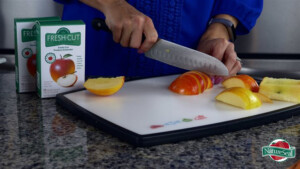 man cutting apples