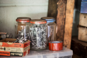 Jars on shelf with hardware